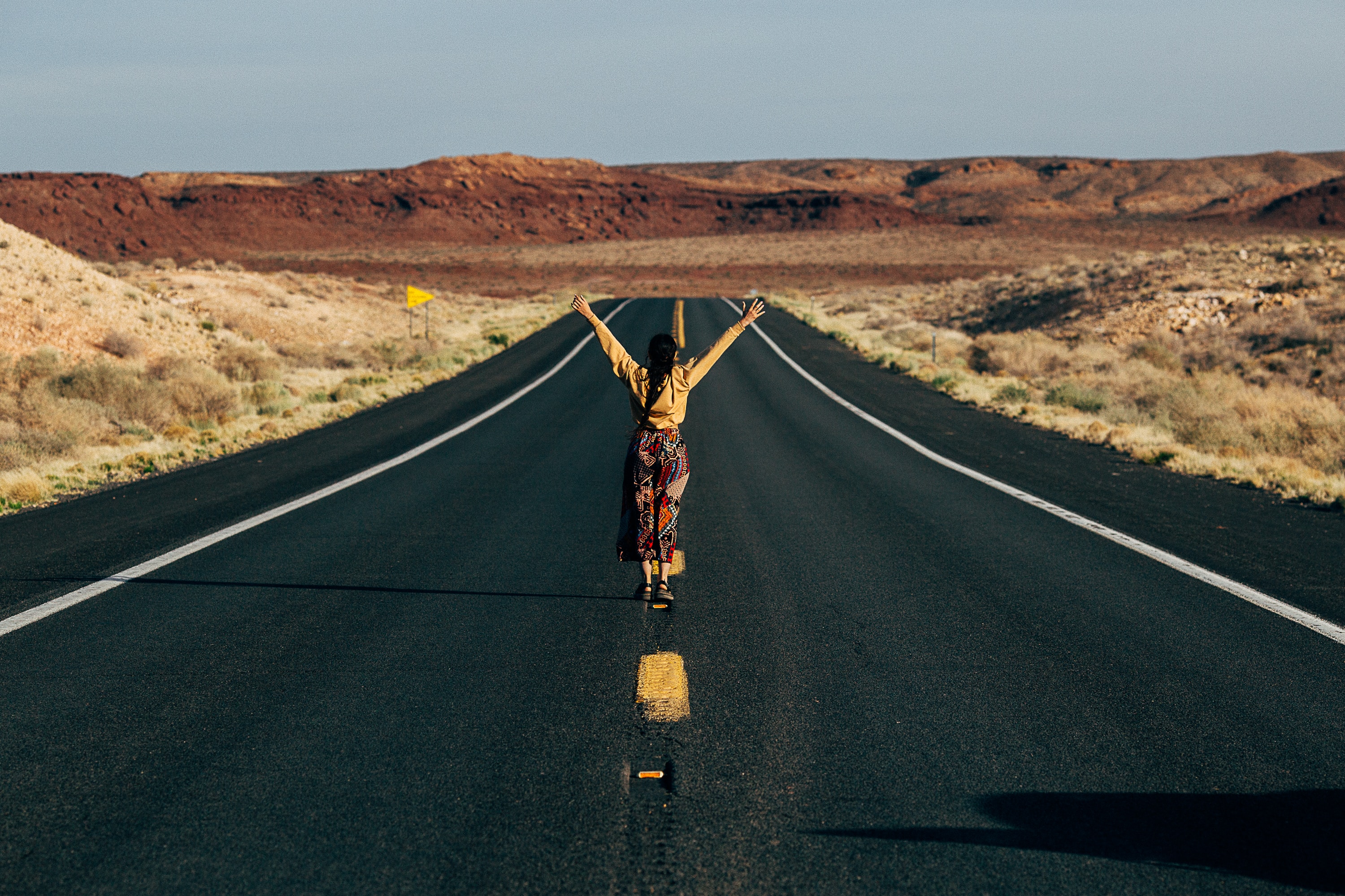 Woman overlooking the Grand Canyon, symbolizing personal growth and exploration.